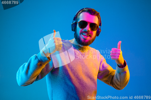 Image of Enjoying his favorite music.