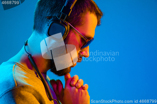 Image of Enjoying his favorite music.