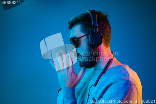 Image of Enjoying his favorite music.