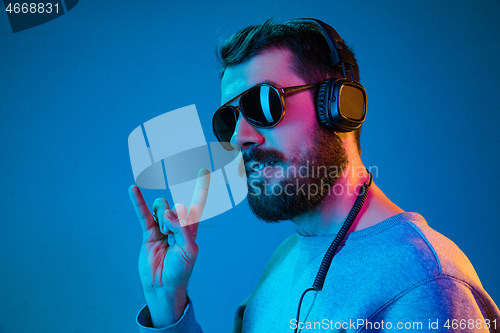 Image of Enjoying his favorite music.