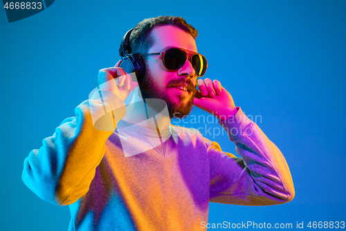 Image of Enjoying his favorite music.