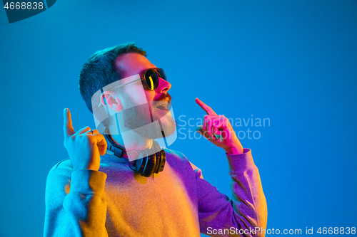 Image of Enjoying his favorite music.