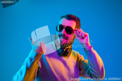 Image of Enjoying his favorite music.