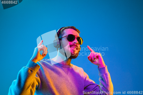 Image of Enjoying his favorite music.