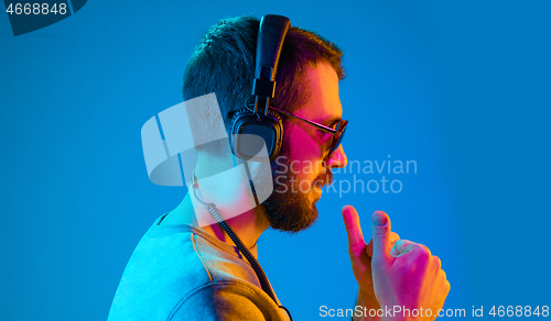 Image of Enjoying his favorite music.