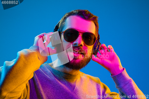 Image of Enjoying his favorite music.