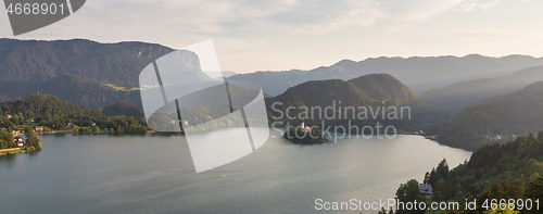 Image of Lake Bled, island with a church and the alps in the background, Slovenia