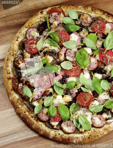 Image of Pizza with Sausages and Tomatoes