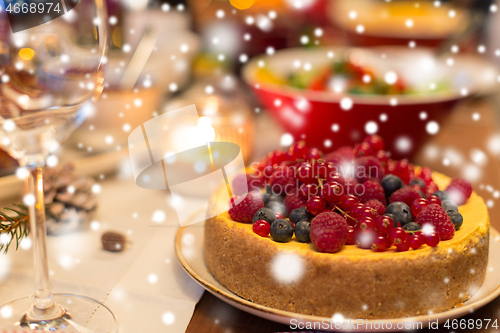 Image of close up of cake and other food on christmas table