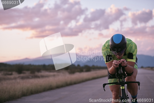 Image of triathlon athlete riding a bike