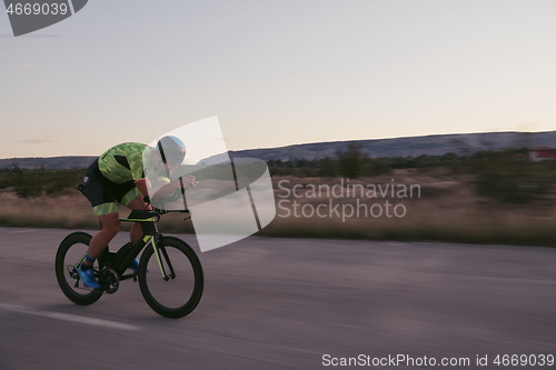 Image of triathlon athlete riding a bike