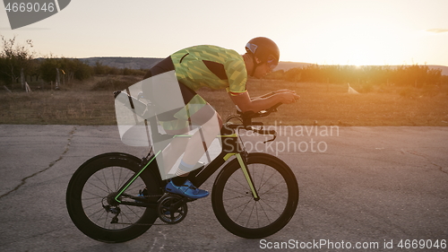 Image of triathlon athlete riding a bike