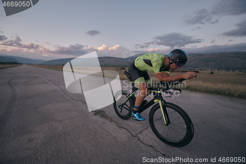 Image of triathlon athlete riding a bike