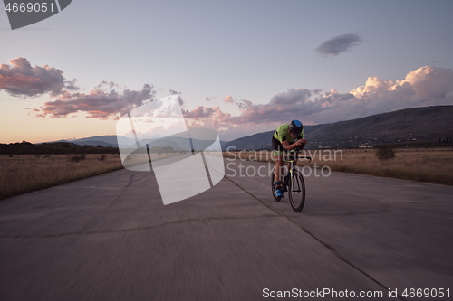 Image of triathlon athlete riding a bike