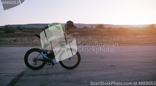 Image of triathlon athlete riding a bike