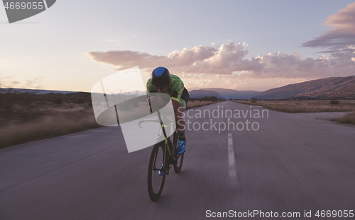 Image of triathlon athlete riding a bike