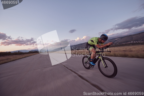 Image of triathlon athlete riding a bike