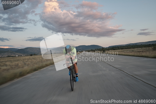 Image of triathlon athlete riding a bike