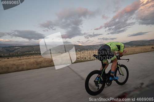 Image of triathlon athlete riding a bike