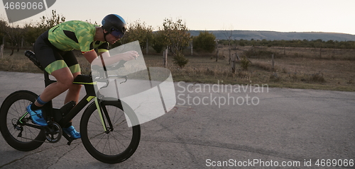 Image of triathlon athlete riding a bike