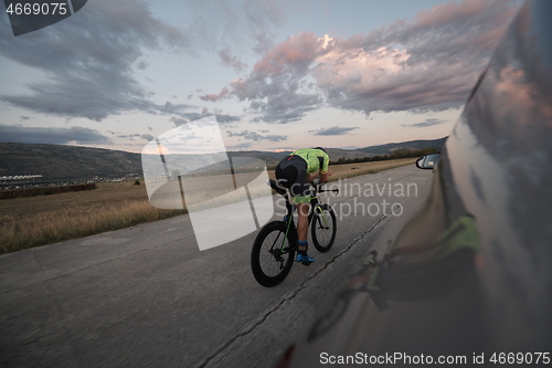 Image of triathlon athlete riding a bike