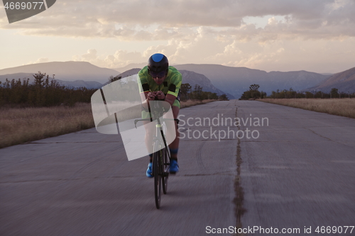 Image of triathlon athlete riding a bike