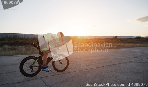 Image of triathlon athlete riding a bike