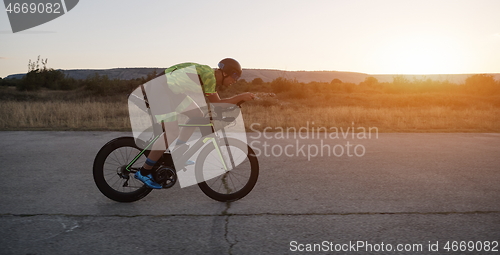 Image of triathlon athlete riding a bike