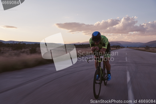 Image of triathlon athlete riding a bike