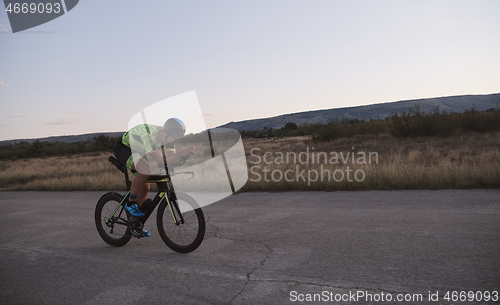 Image of triathlon athlete riding a bike