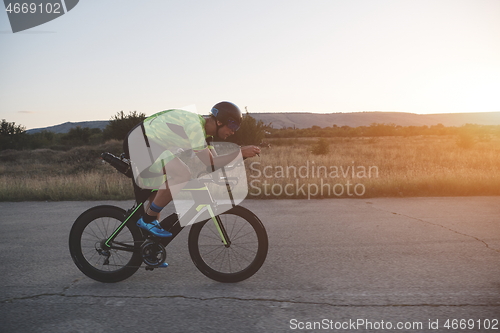 Image of triathlon athlete riding a bike