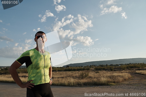 Image of triathlon athlete running on morning trainig