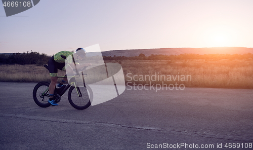 Image of triathlon athlete riding a bike