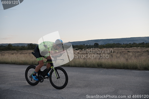 Image of triathlon athlete riding a bike