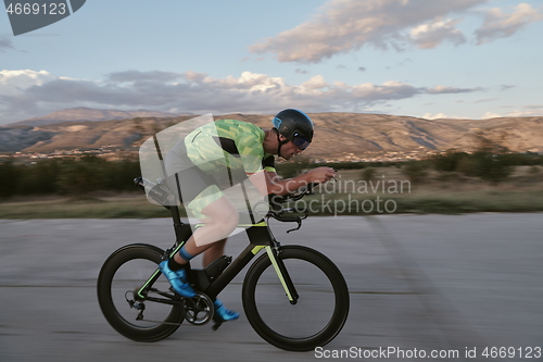 Image of triathlon athlete riding a bike