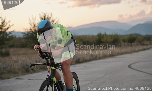 Image of triathlon athlete riding a bike