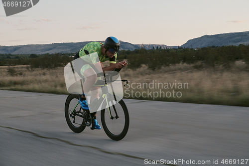 Image of triathlon athlete riding a bike