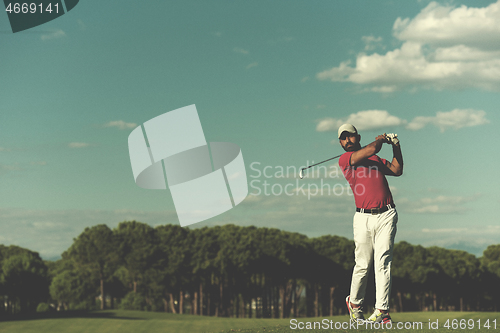 Image of golf player hitting long shot