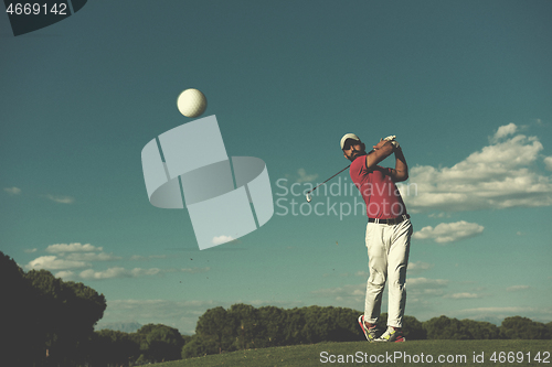 Image of golf player hitting long shot