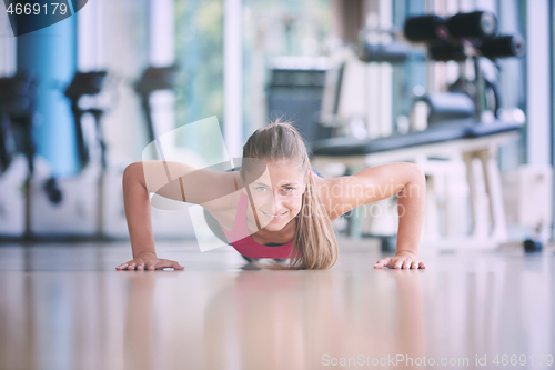 Image of warming up and doing some push ups a the gym