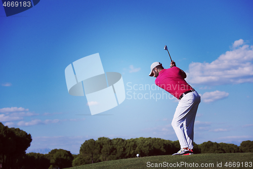 Image of golf player hitting long shot