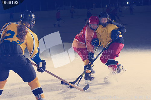 Image of teen ice hockey sport  players in action