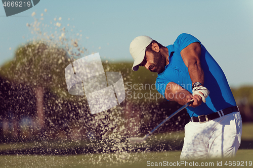 Image of pro golfer hitting a sand bunker shot