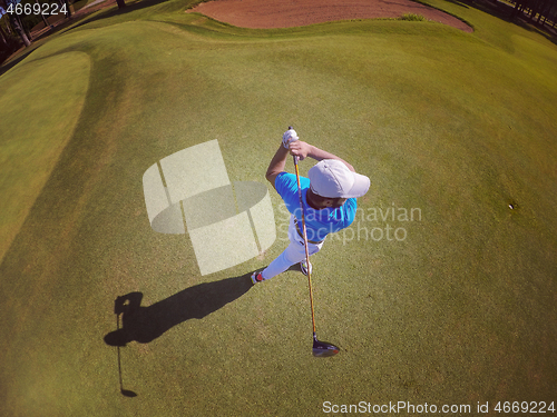 Image of top view of golf player hitting shot