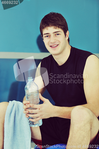 Image of man drink water at fitness workout