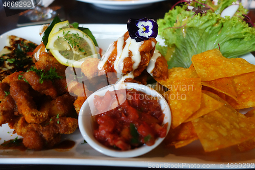 Image of Tapas platter with variety of finger foods