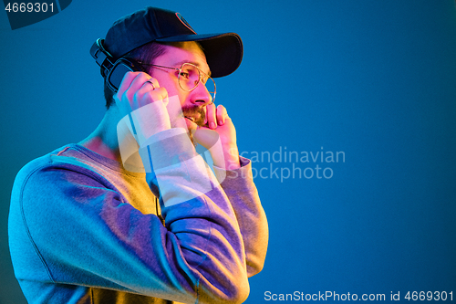 Image of Enjoying his favorite music.