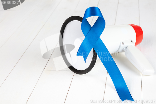 Image of Blue ribbon symbolic of prostate cancer awareness campaign and men\'s health in November