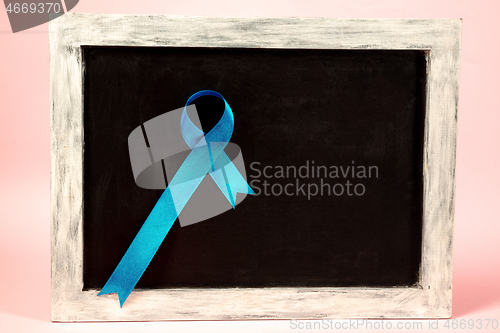 Image of Colon cancer awareness poster. Blue ribbon made of dots on white background. Medical concept.