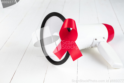 Image of Aids Awareness Sign Red Ribbon. World Aids Day concept.